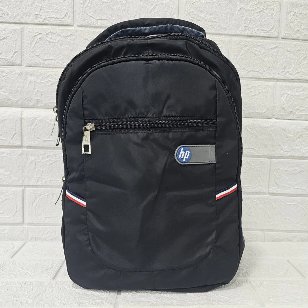 Di0029 HP Black Backpack – Multi-Compartment, Lightweight & Durable
